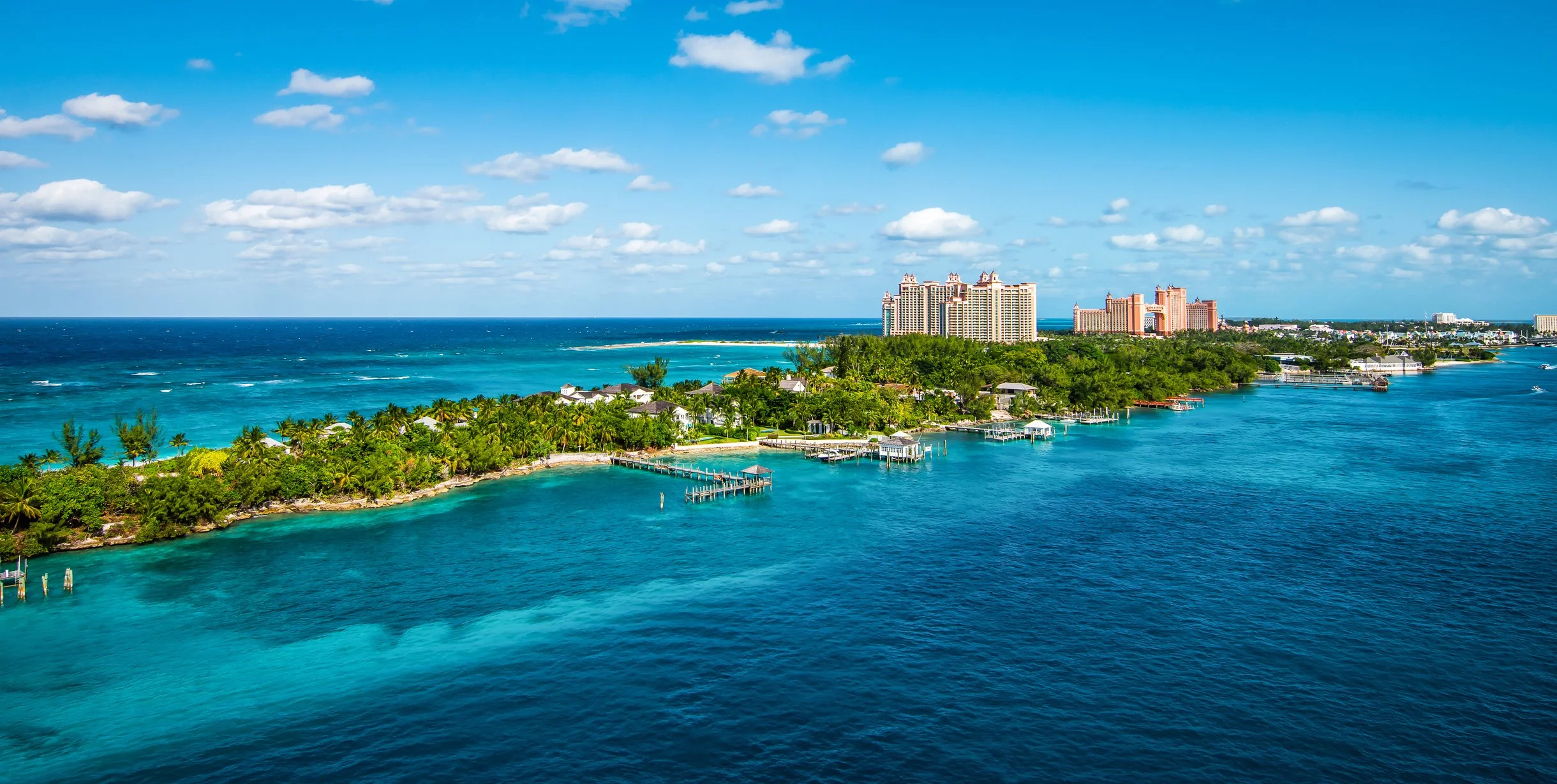 View of Paradise Island's hotels, lush landscaping, and beach from above.