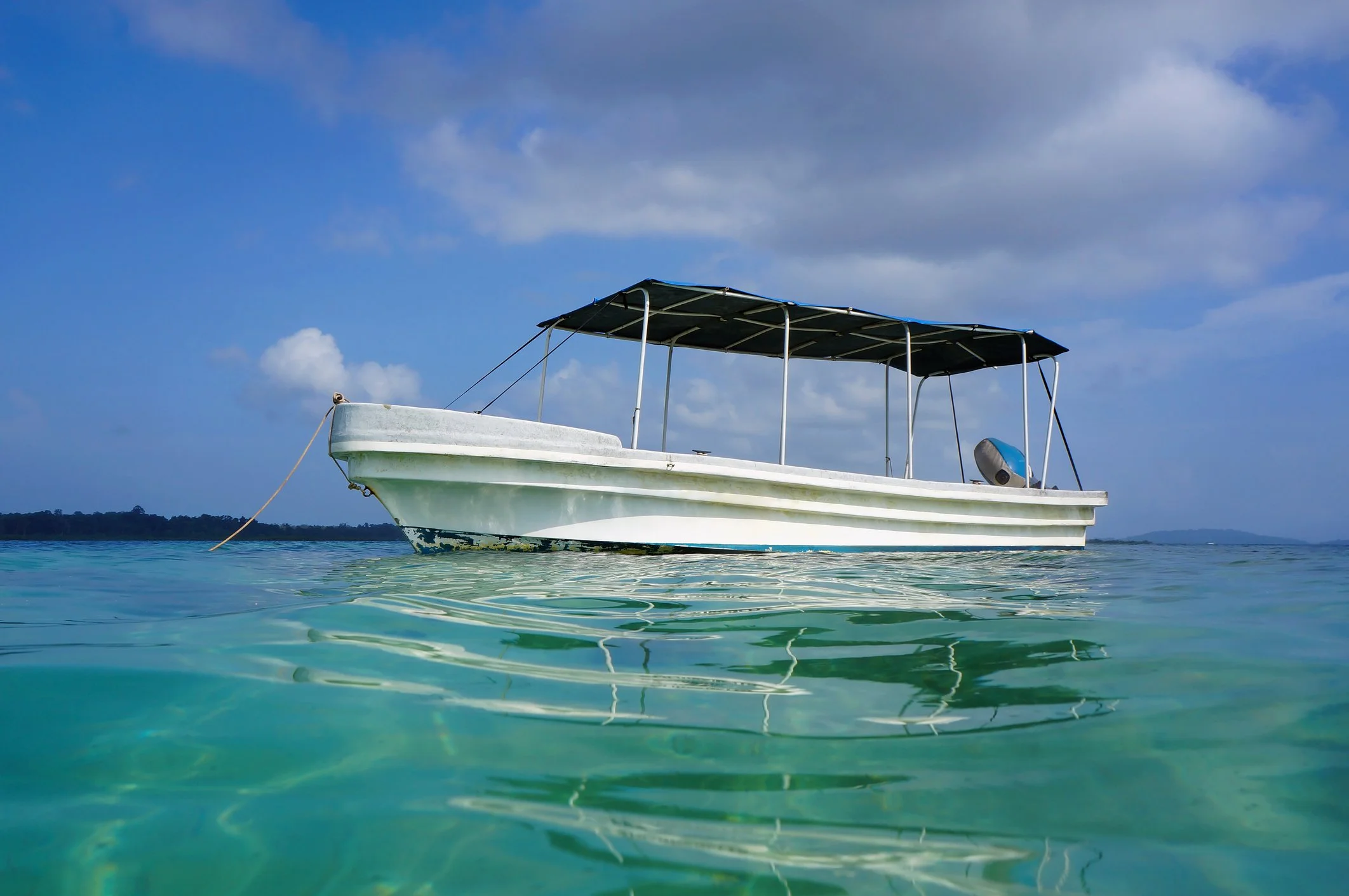 Fishing boat in the aquamarine water off the coast of Bimini