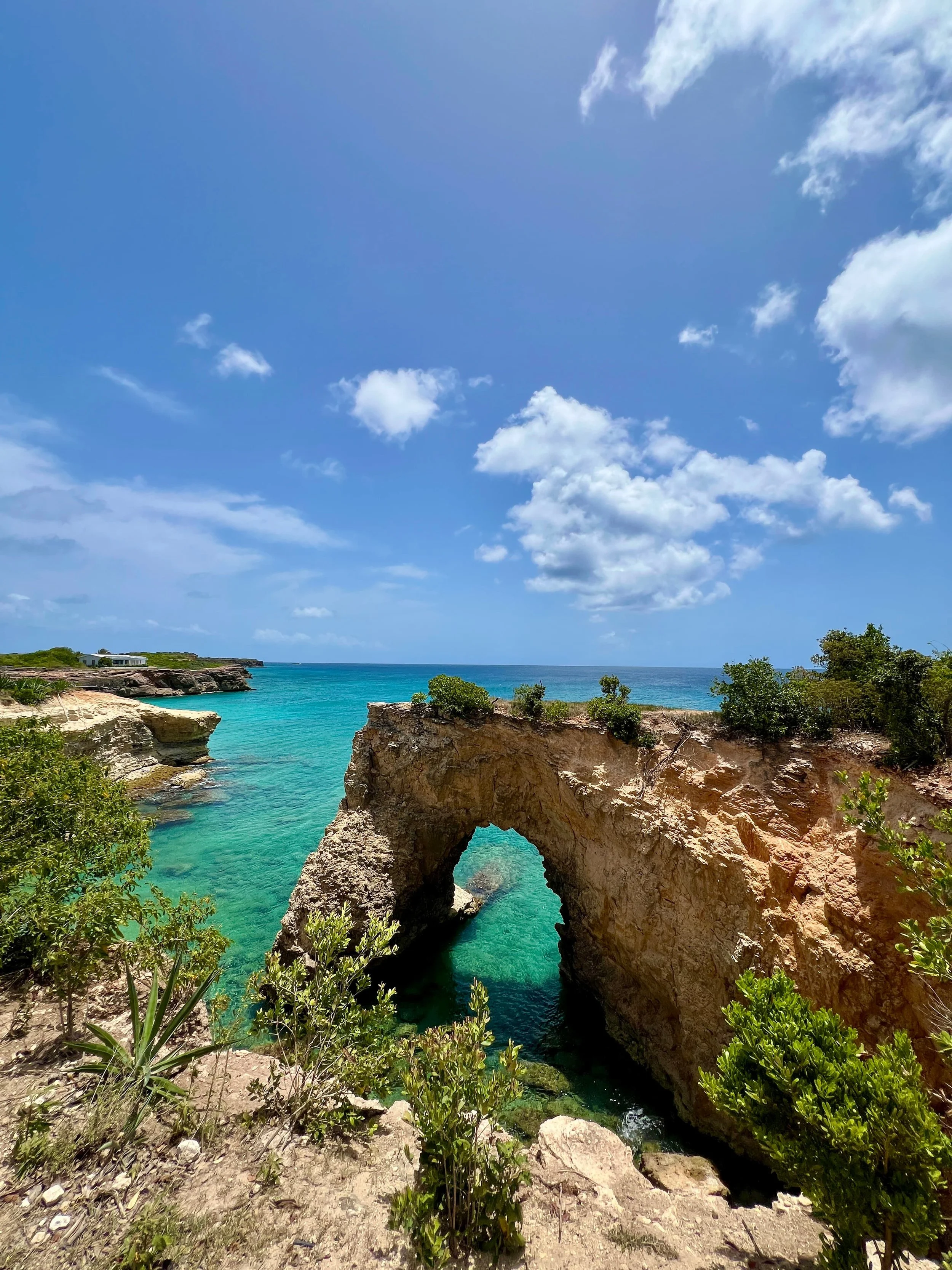 Anguilla’s famous natural rock arch rising above clear Caribbean waters.