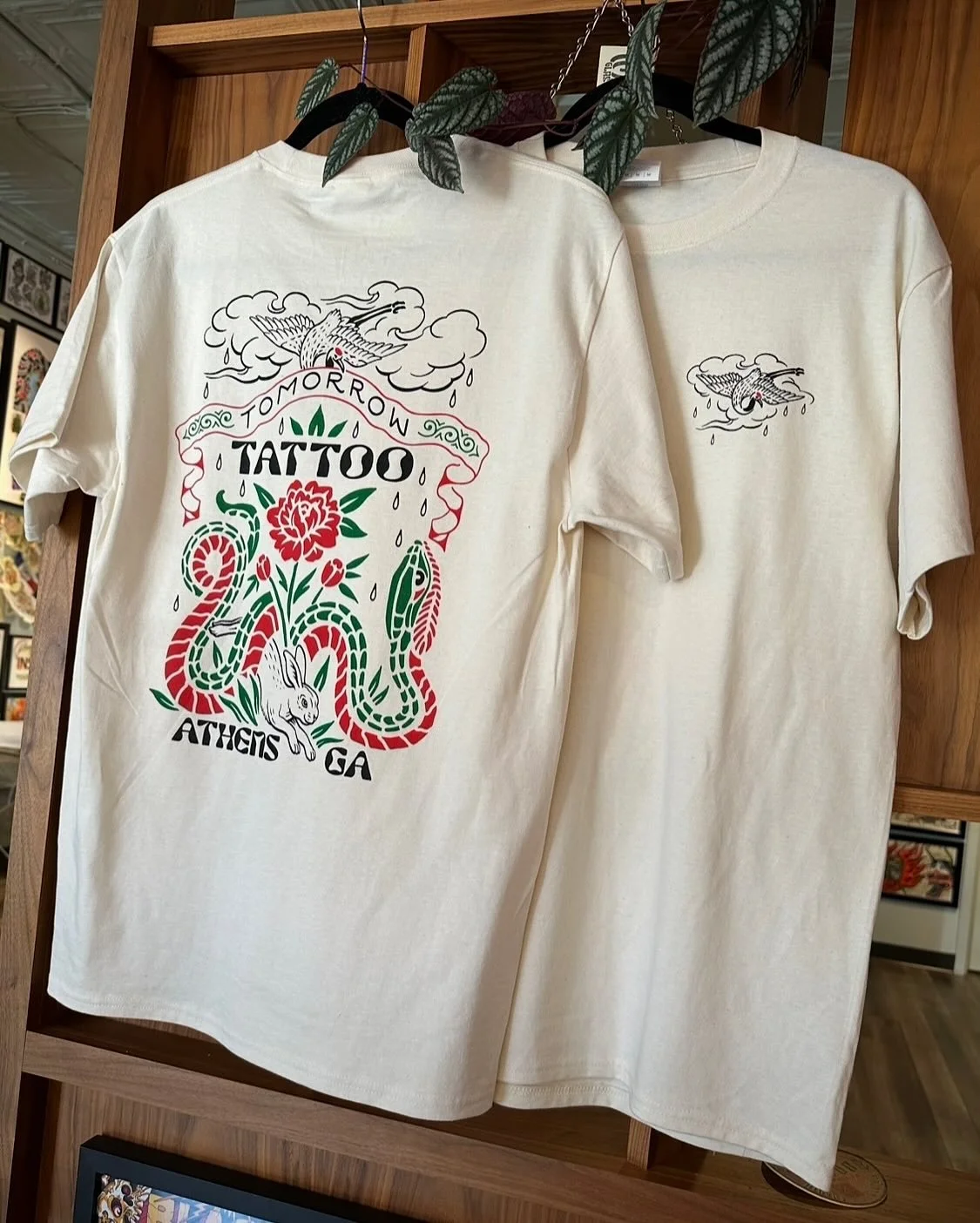 New short sleeve tees are in! Available in black and off-white. 100% cotton shirts printed right here in Athens, GA by @satisfactoryshopcat ! Available on our website or in store @tomorrow_tattoo 🌧️🌱🐇
&bull;
#georgiatattooartist #athensga #georgia