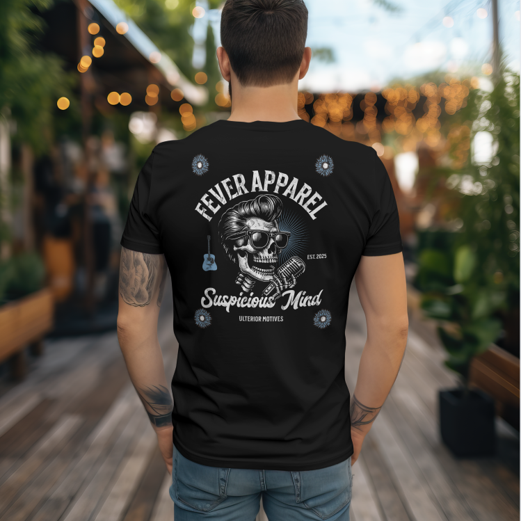 Back of a man wearing a black T-shirt with a skull graphic wearing sunglasses, accompanied by text that reads 'Fever Apparel, Suspicious Mind, Est. 2025, Ulterior Motives,' along with small decorative elements including a guitar and blue icons, in an