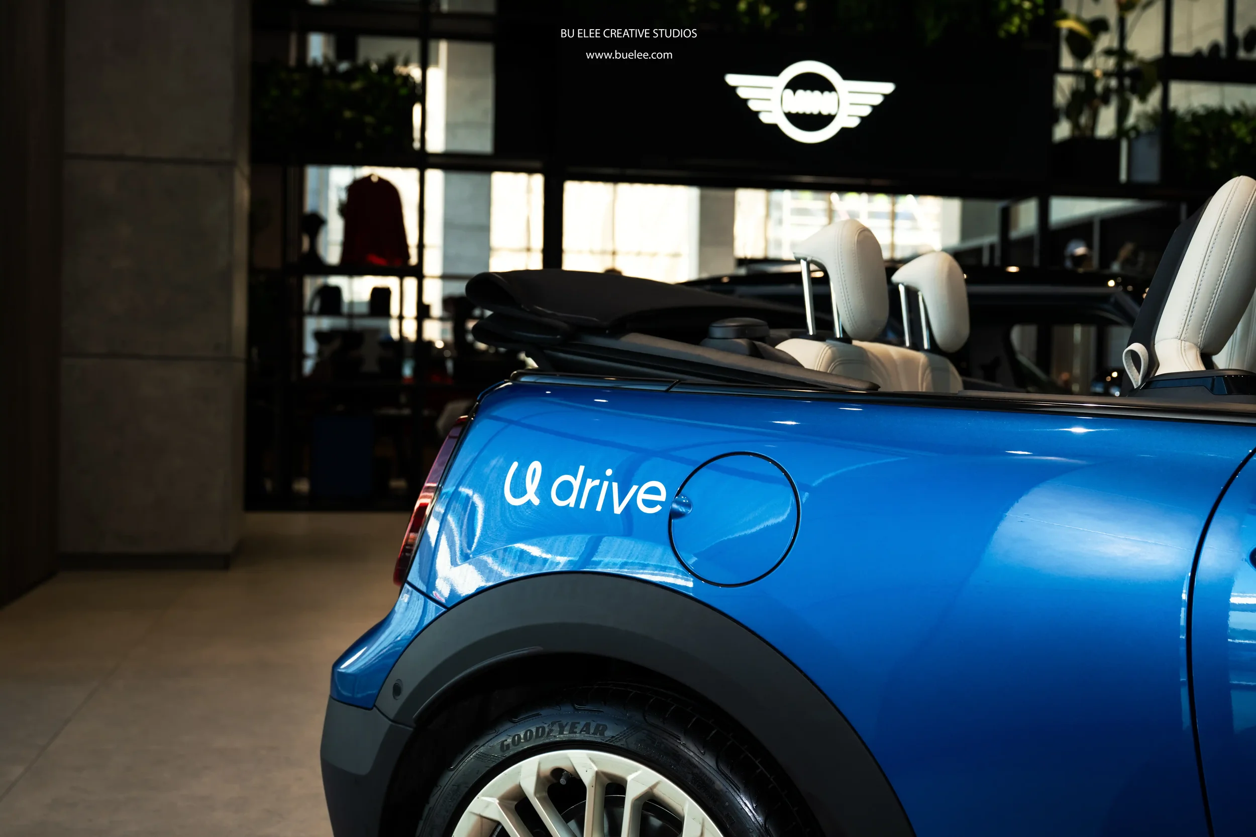 Udrive signage on Mini Cooper displayed during signing ceremony between AGMC and Udrive.