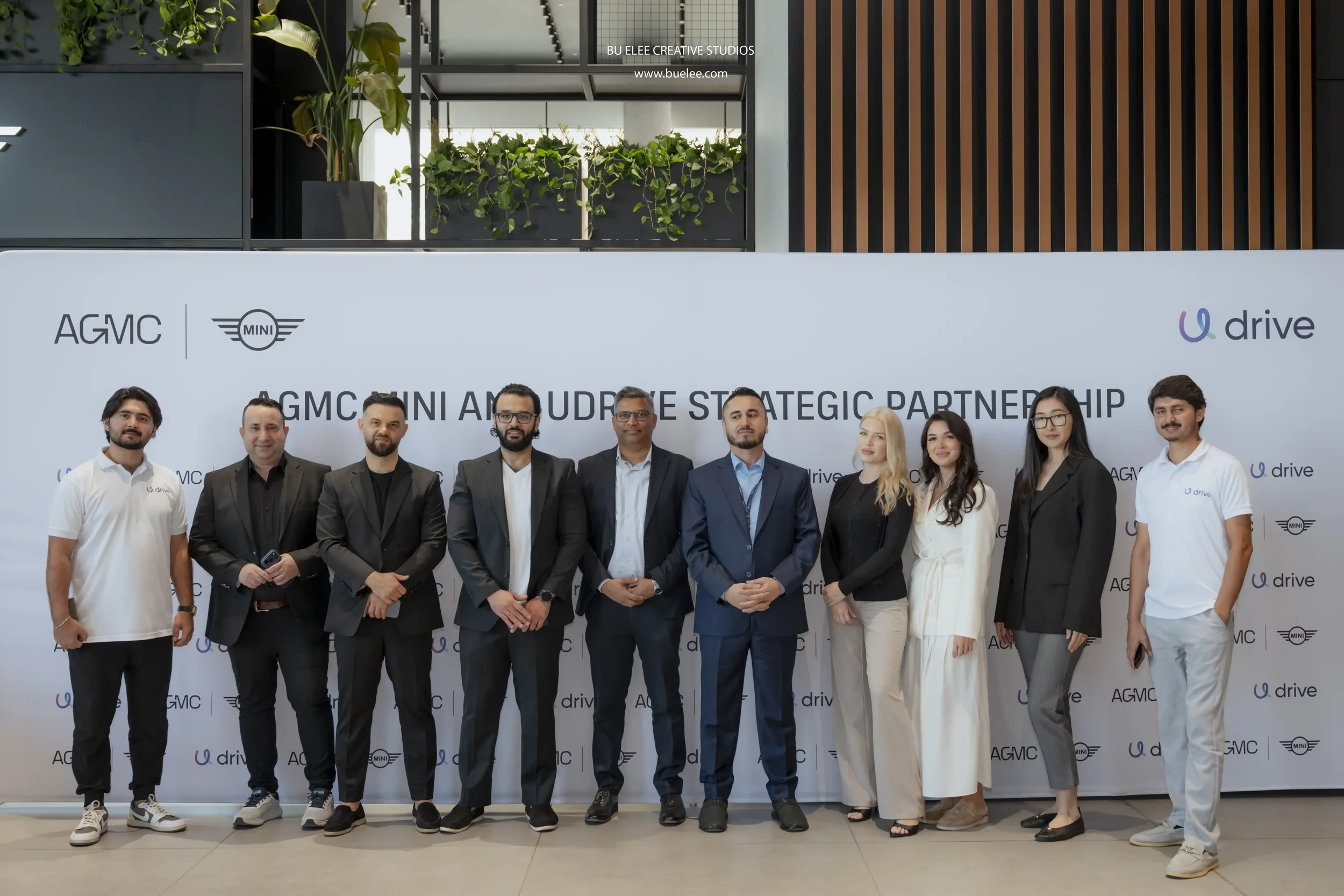  Group photo of Udrive Team with their CEO during signing ceremony with AGMC Motors.  
