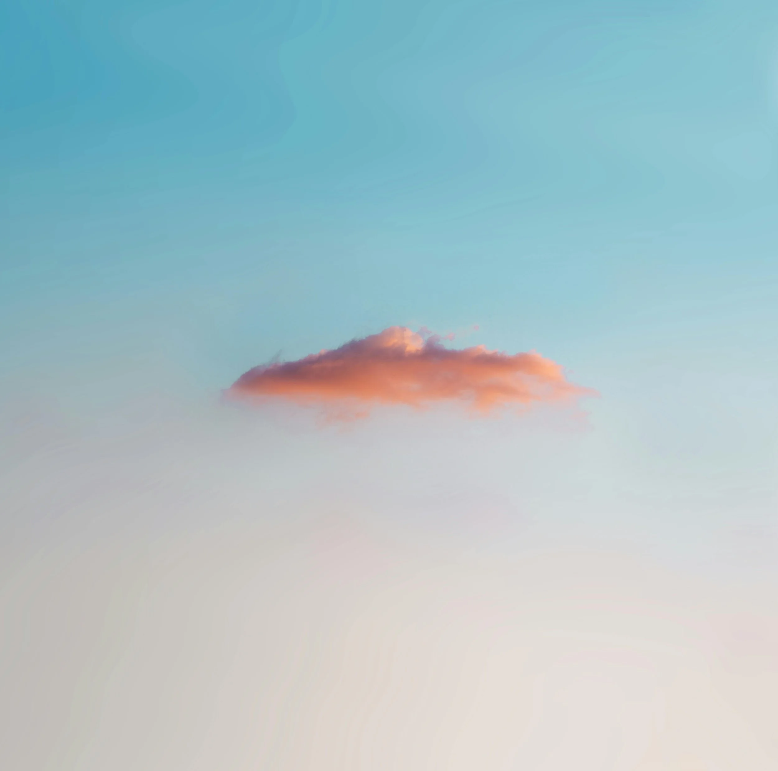 Colorful sunset sky with orange, pink, and blue clouds.