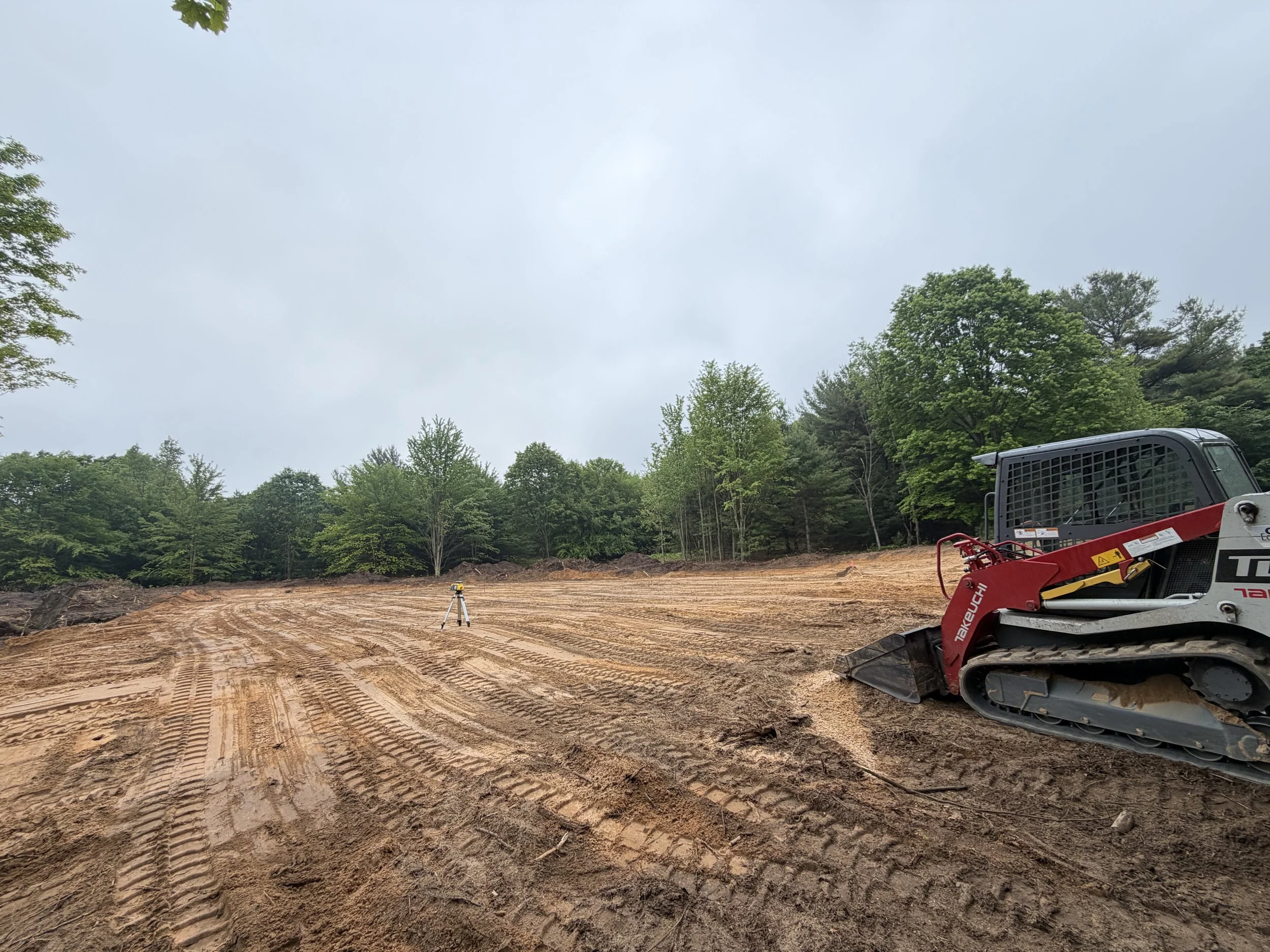 Grading a pole barn building pad site for new construction in New Era Michigan