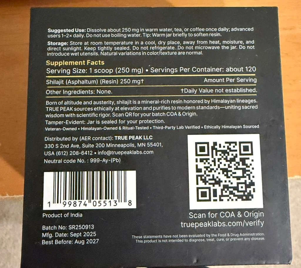 Black supplement package label with text and a QR code, containing product and usage information for Shilajit (Resin) from India, manufactured in September 2025, best before August 2027.