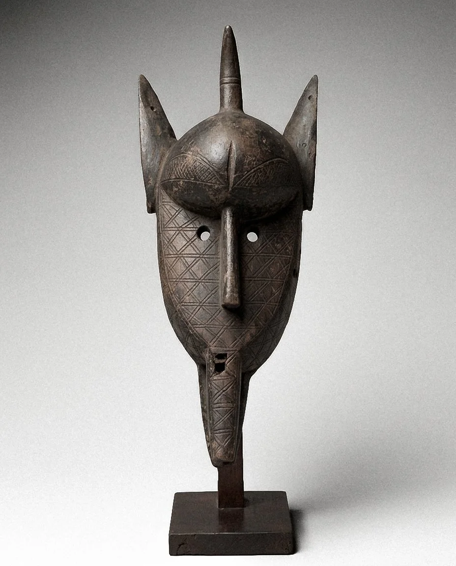 Firefly_Gemini Flash_Replace statue in reference image 1 with same African mask sculpture in reference ima 411569-3.jpg