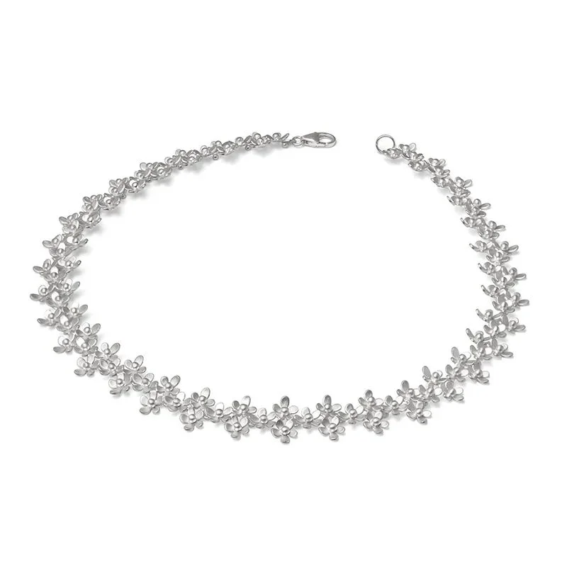 Silver floral necklace with small flower charms and lobster clasp