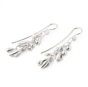 A pair of silver earrings with dangling leaf-shaped charms