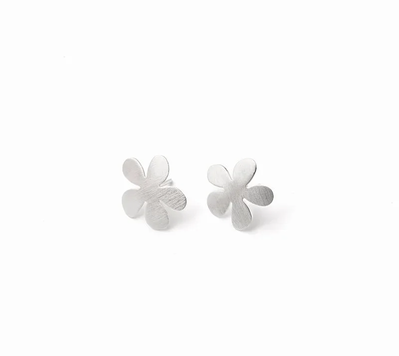 Silver flower-shaped stud earrings on a white background.