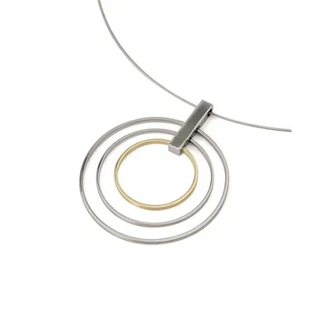Silver and gold concentric circle pendant necklace on a white background.