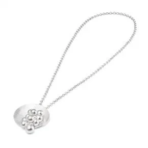 Silver necklace with a pendant featuring a cluster of small flowers.