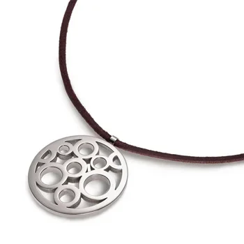 A silver circular pendant with multiple cut-out circles hanging on a brown leather cord
