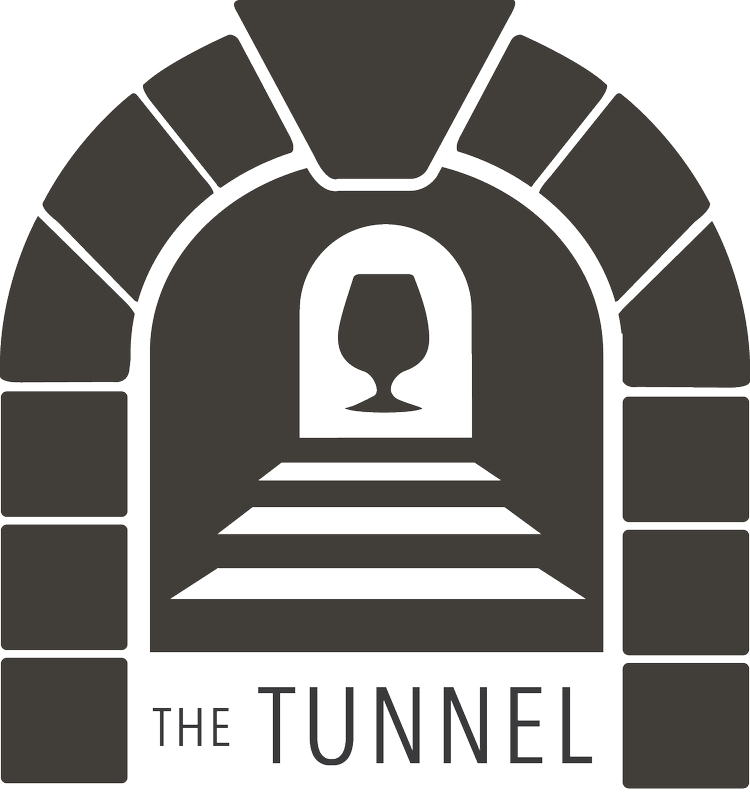 A stylized graphic of a tunnel with stone arch and steps leading underground, with a glass of wine at the end, and the words 'The Tunnel' at the bottom.