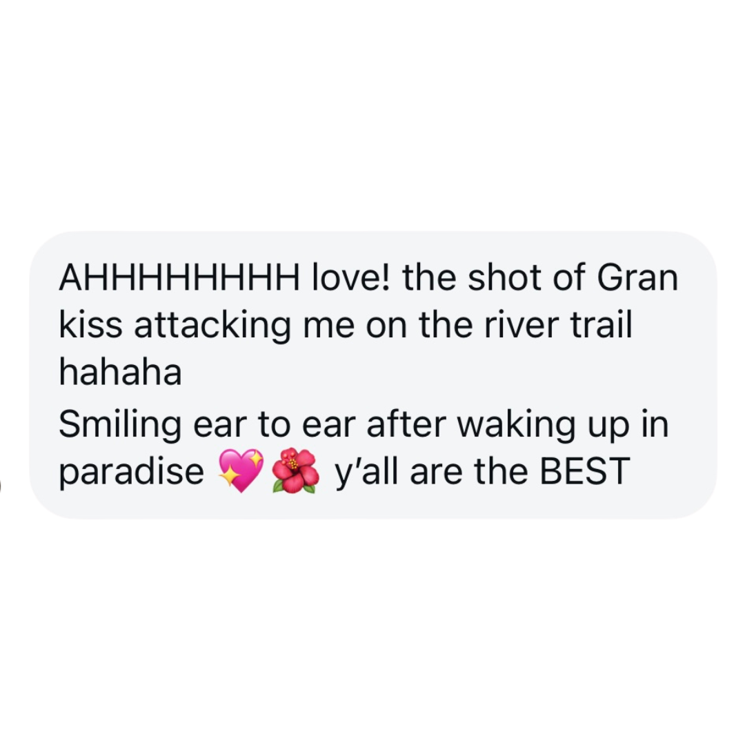 Text message praising a photo of a kiss on the river trail, mentioning happiness and smiling after waking up in paradise, with heart and flower emojis.