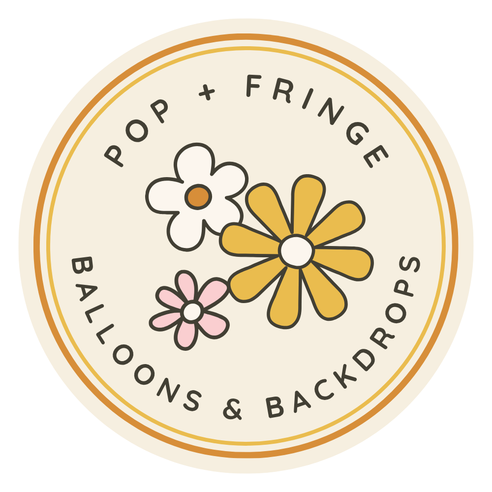 A circular logo with a cream background, featuring three cartoon flowers in white, pink, and yellow. The text around the circle reads "Pop + Fringe" at the top and "Balloons & Backdrops" at the bottom, in black font.