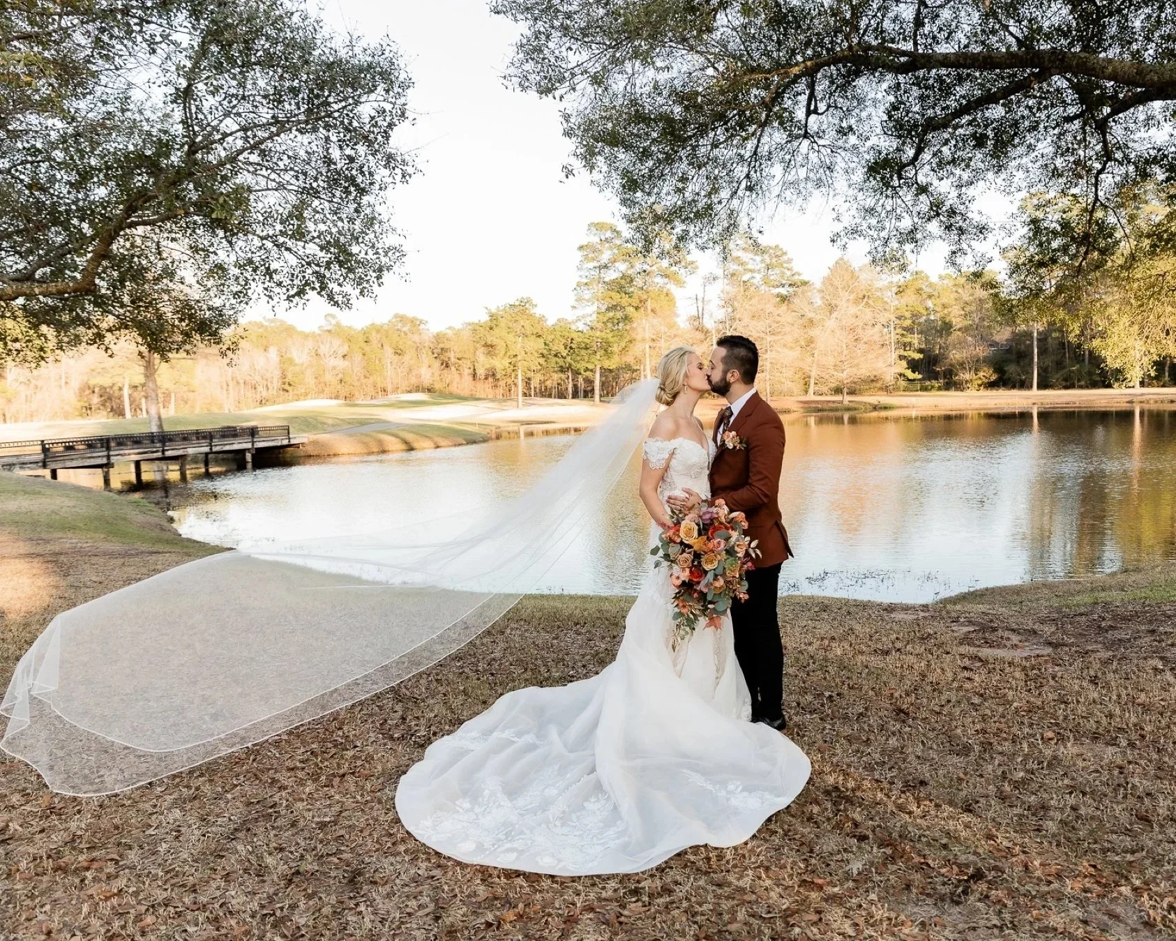 bride-and-groom-veil-blowing-portrait-woodlands-country-club