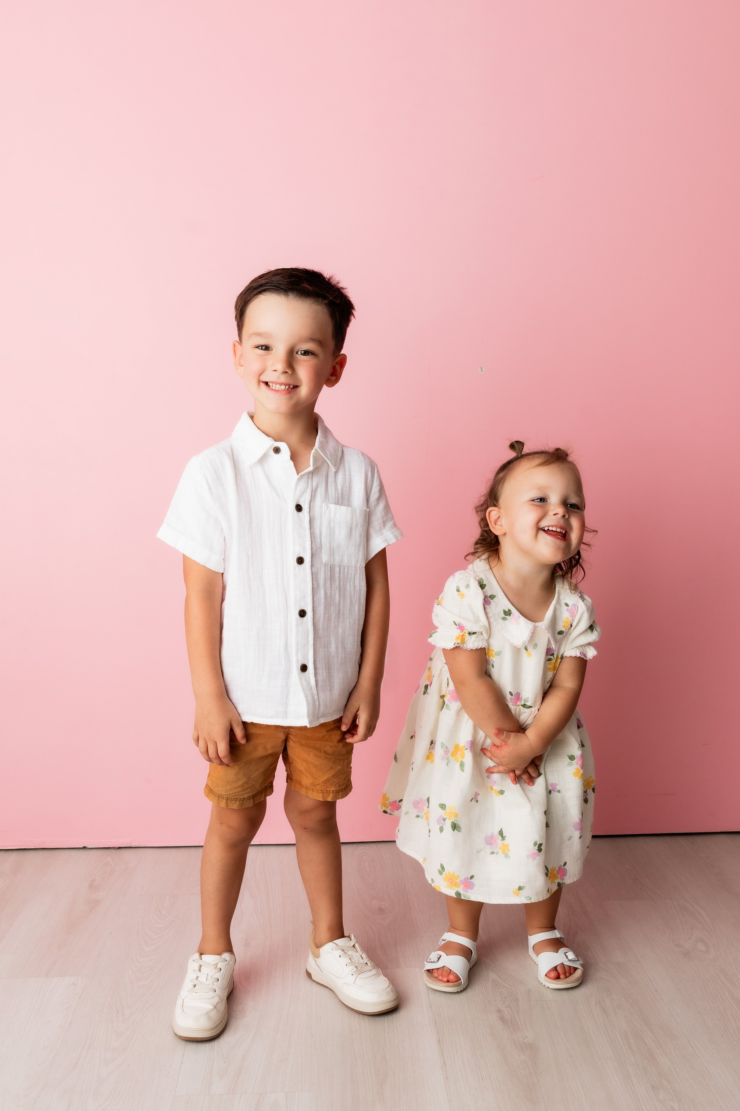 smiling-siblings-colorful-studio-portrait-session-the-woodlands-tx