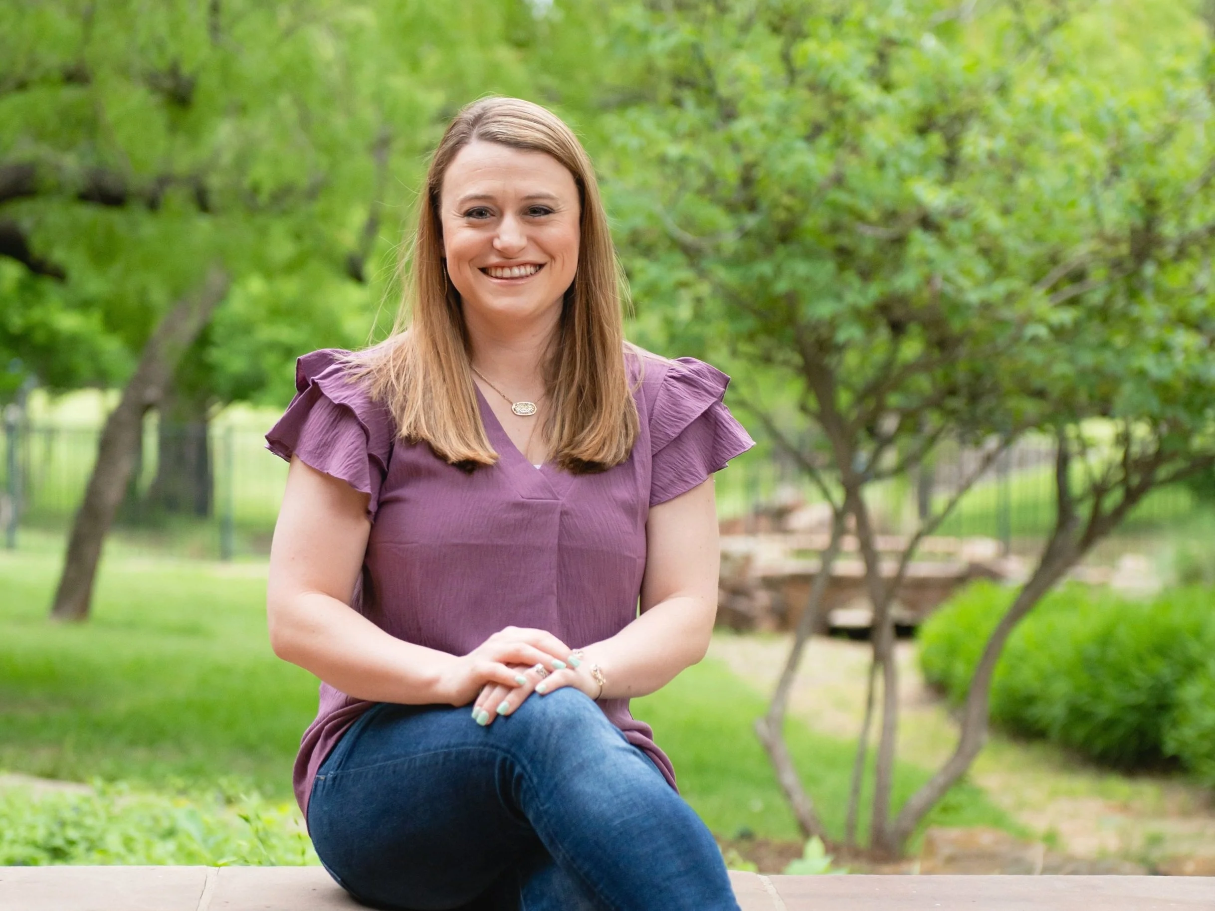 Ashley Hardy sitting in a park