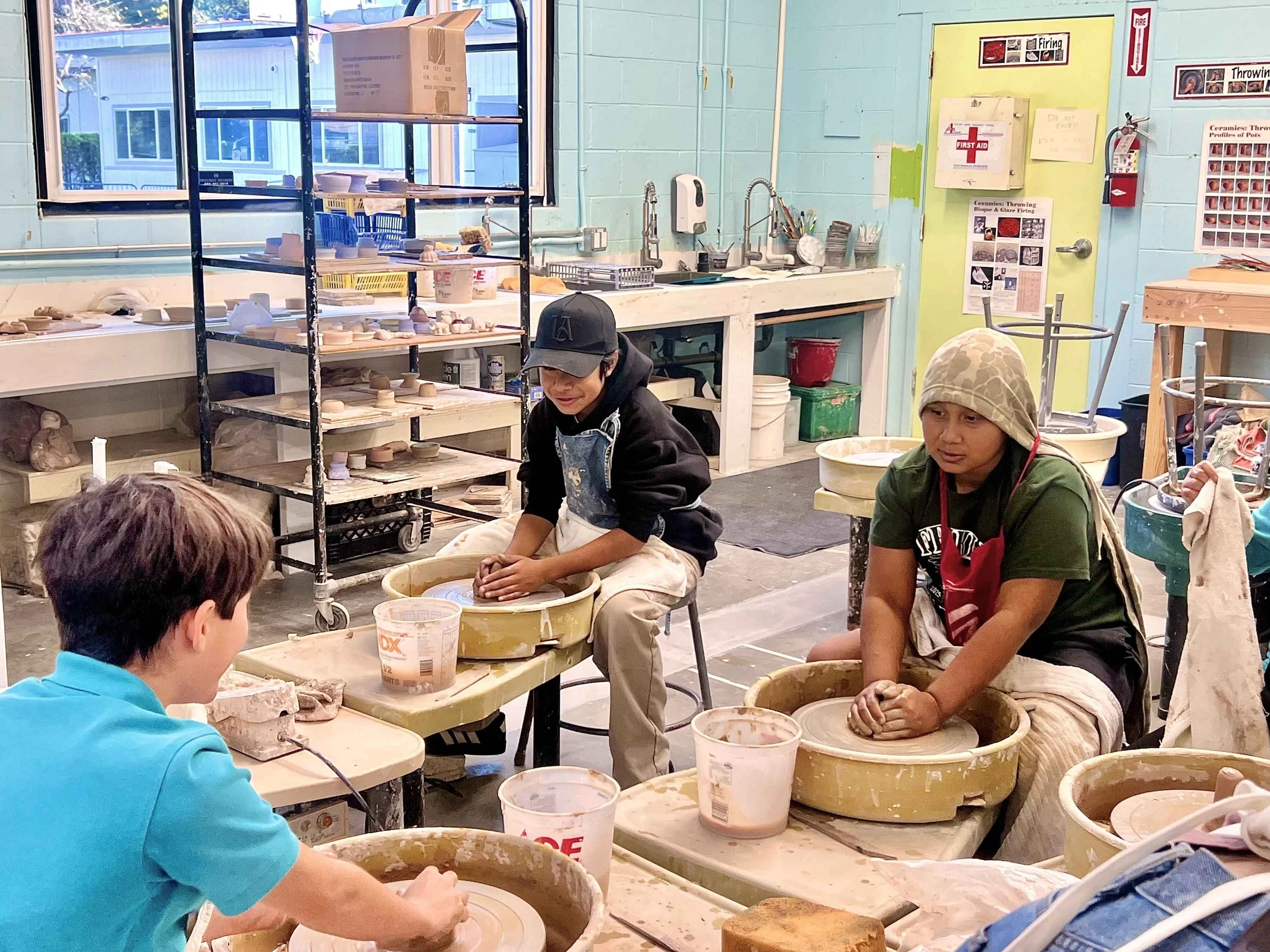 Club members working on creative art projects together