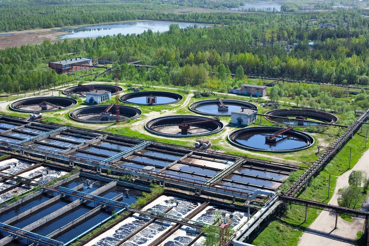 Aerial view of a water treatment plant with clarifier tanks — water infrastructure coatings and linings by Allied Industrial Services