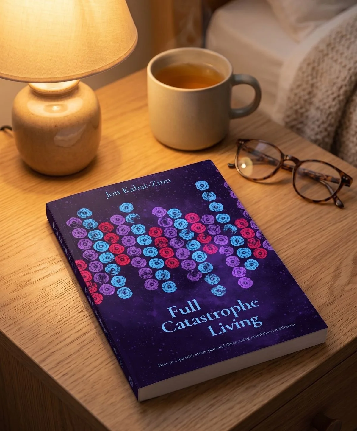 Book cover illustration for Full Catastrophe Living by Jon Kabat-Zinn - mixed media artwork with nocturnal atmosphere, warm evening light mockup on bedside table