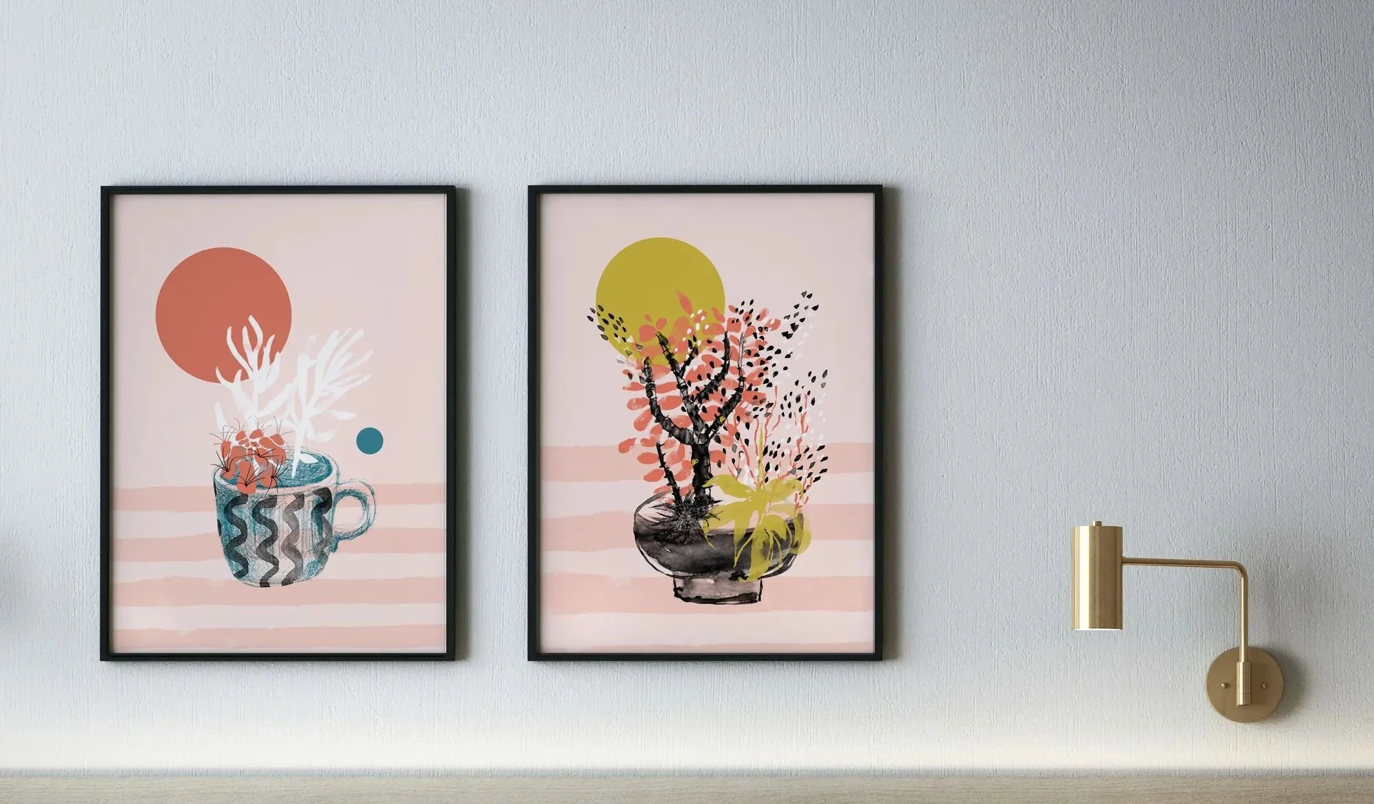 Two floral compositions framed on a wall beside a lamp - warm pinks, dark teal blues, and golden greens with strong watercolor texture.