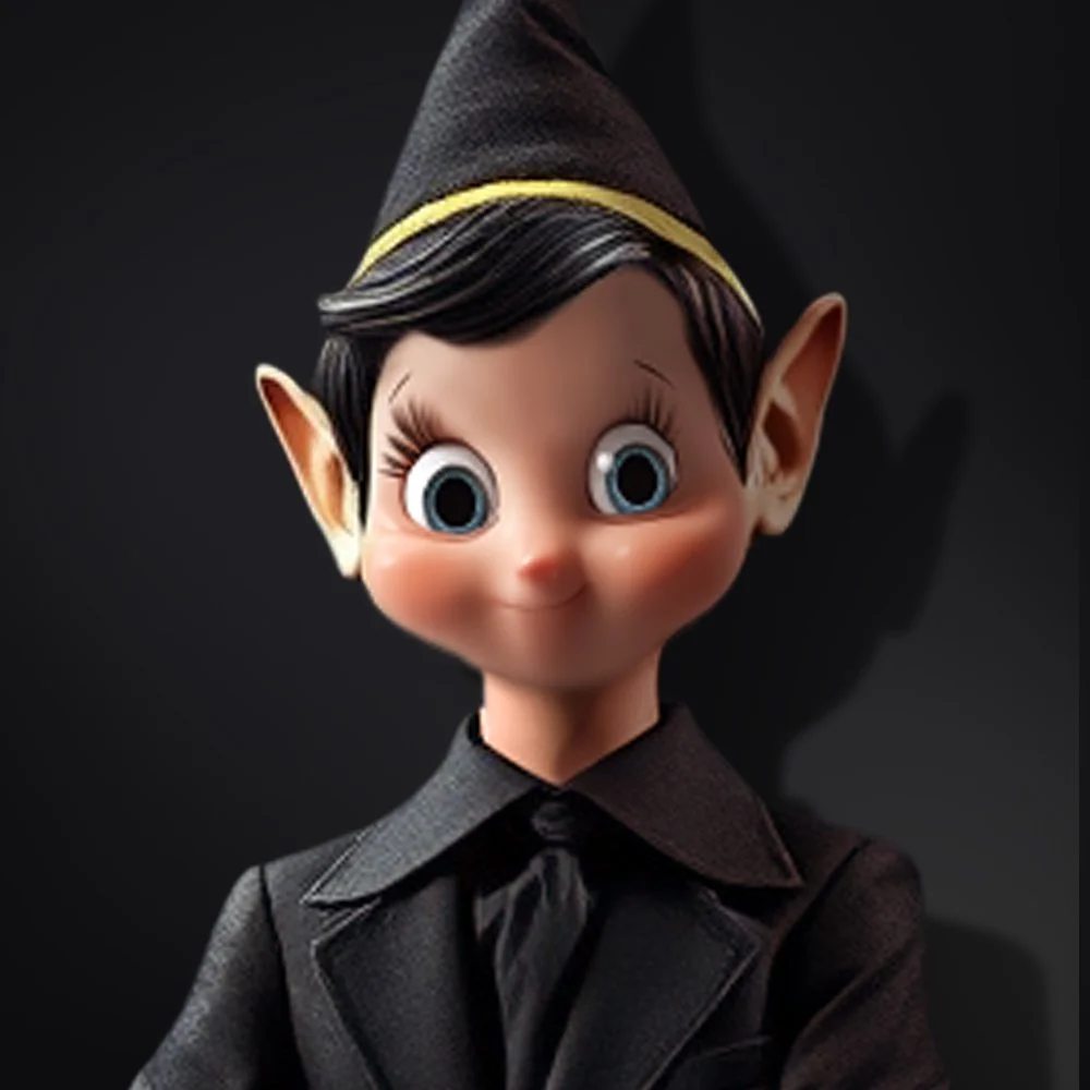 Close-up of an animated elf character with large blue eyes, pointy ears, black hair, wearing a black pointed hat with yellow trim and a black suit with a tie, against a dark background.