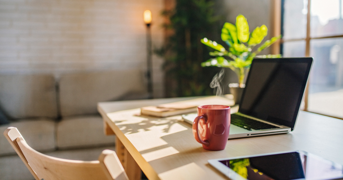 Laptop with coffee cup