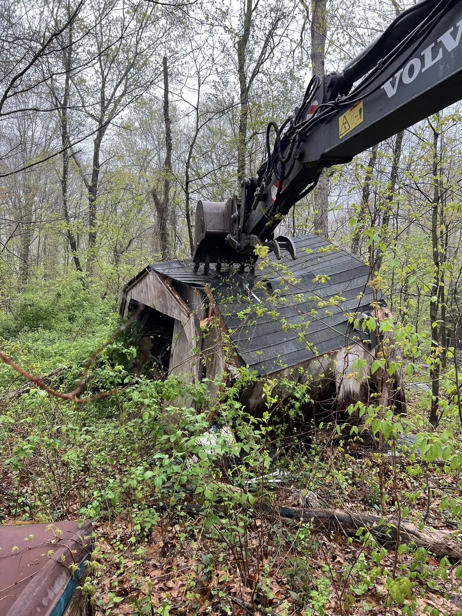 Demolition of a small shed. Trash removal.
