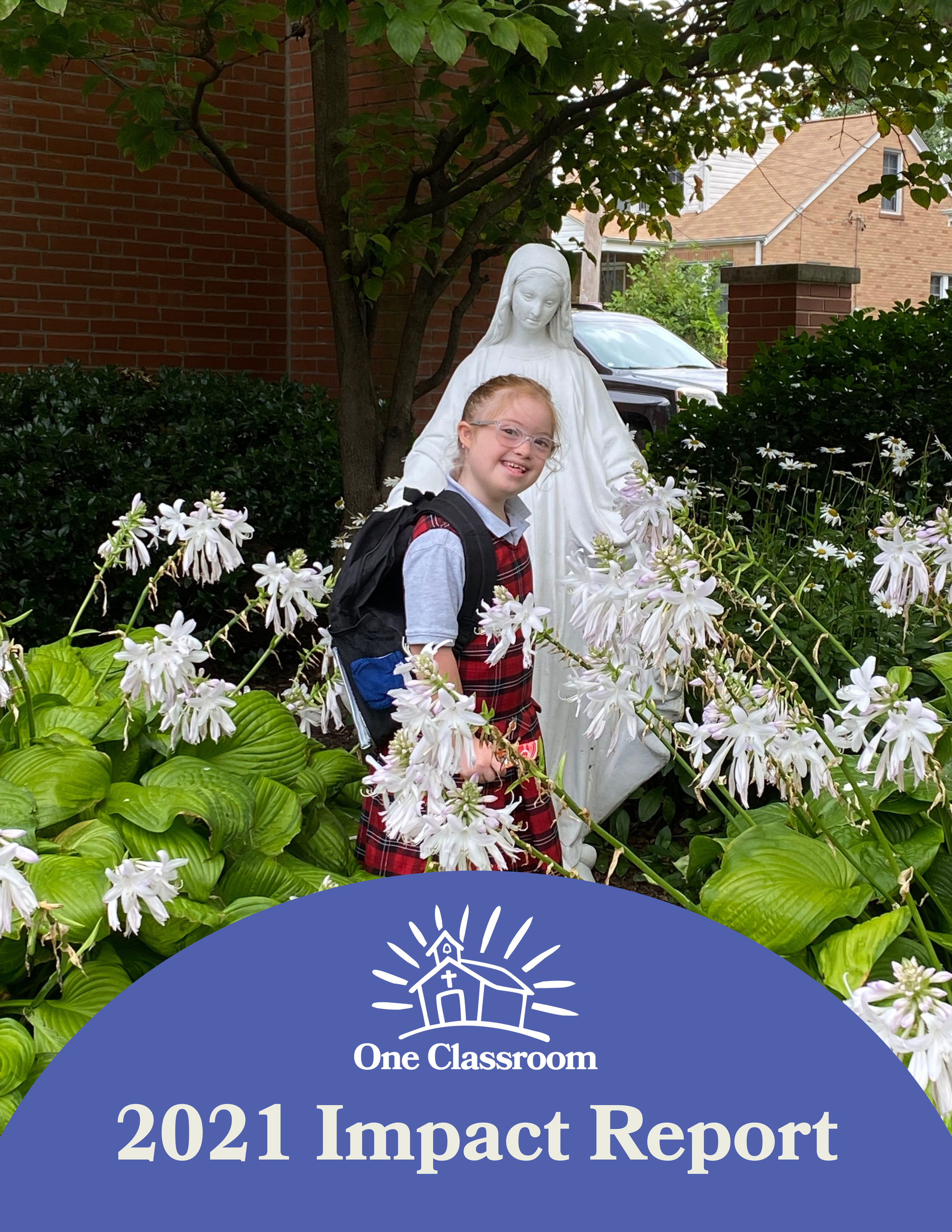 A young girl with glasses and a backpack stands in front of a floral garden with a statue of Jesus Christ, surrounded by green plants and flowers, in an outdoor residential setting. The bottom part of the image shows a blue overlay with white text reading 'One Classroom 2021 Impact Report' and a logo of a stylized church with sun rays.