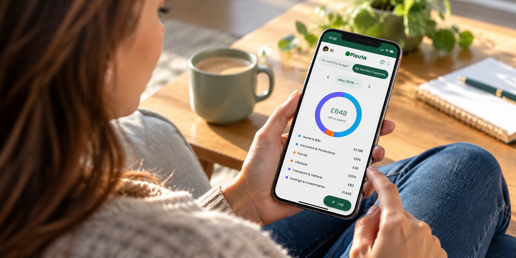 young lady using plouta wealth tracker app to check her expenses