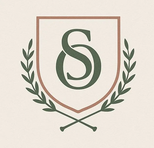 A shield emblem with the letter S inside, surrounded by green laurel branches.