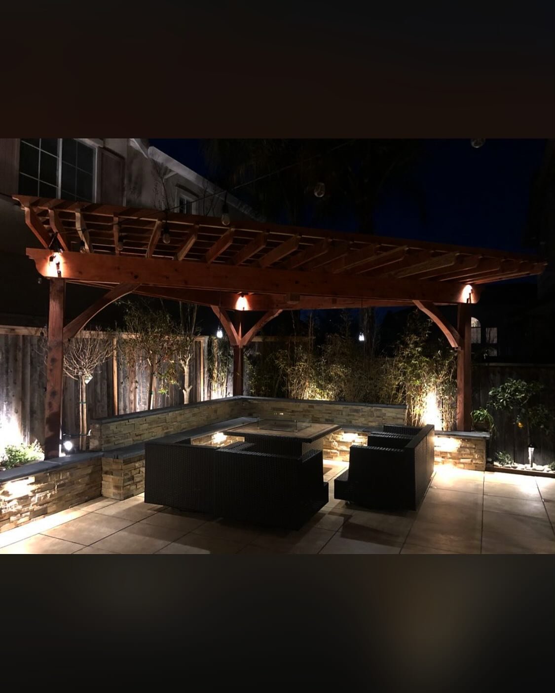 Upgraded for evening gatherings
#hanginglights #fireplace #stone #patio #pergola