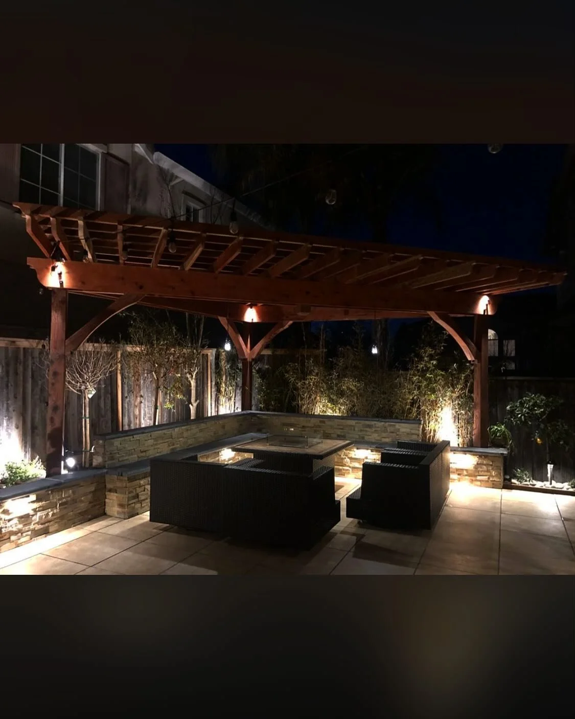 Upgraded for evening gatherings
#hanginglights #fireplace #stone #patio #pergola