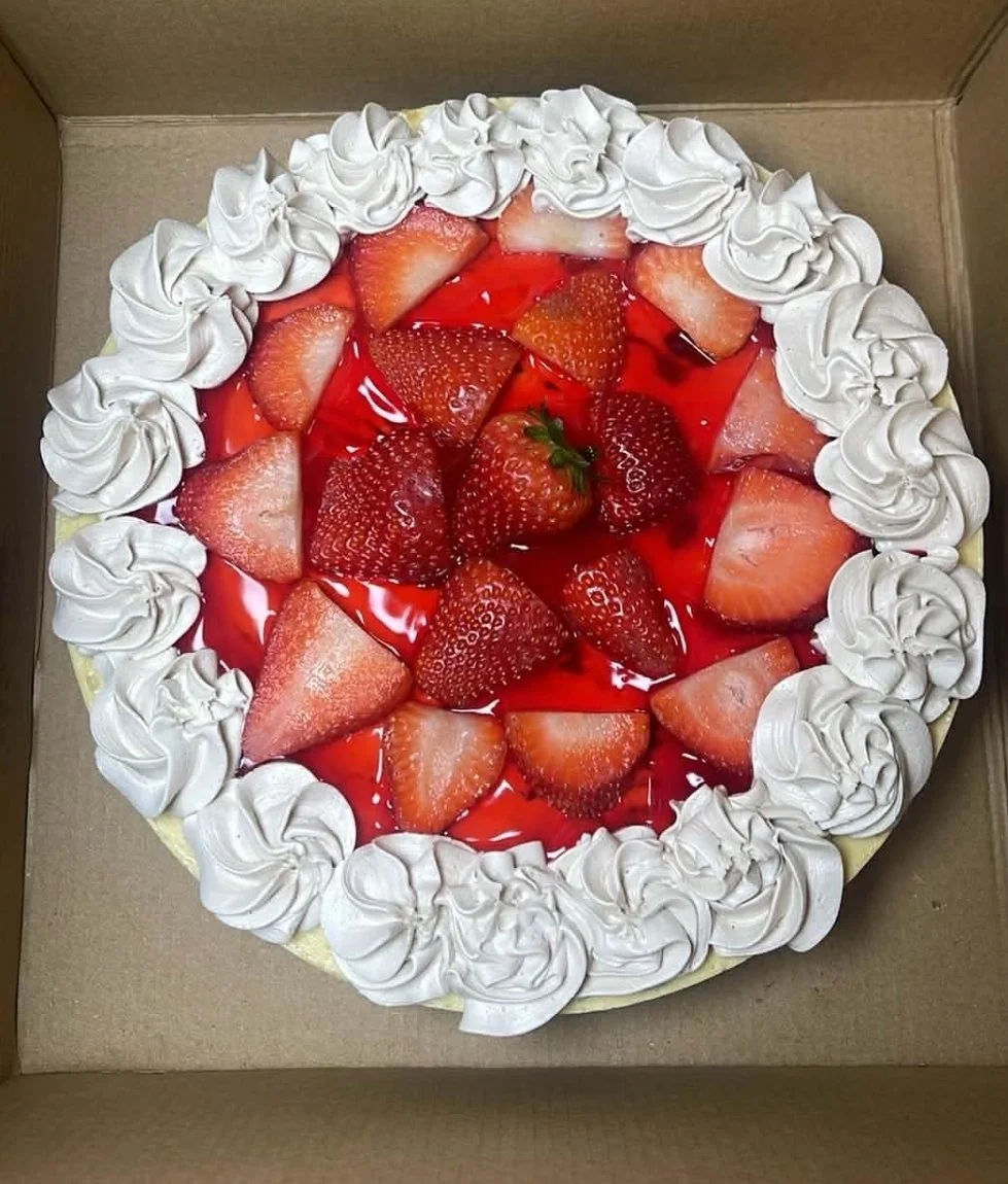 Strawberry Cheesecake with real strawberries and whipped cream