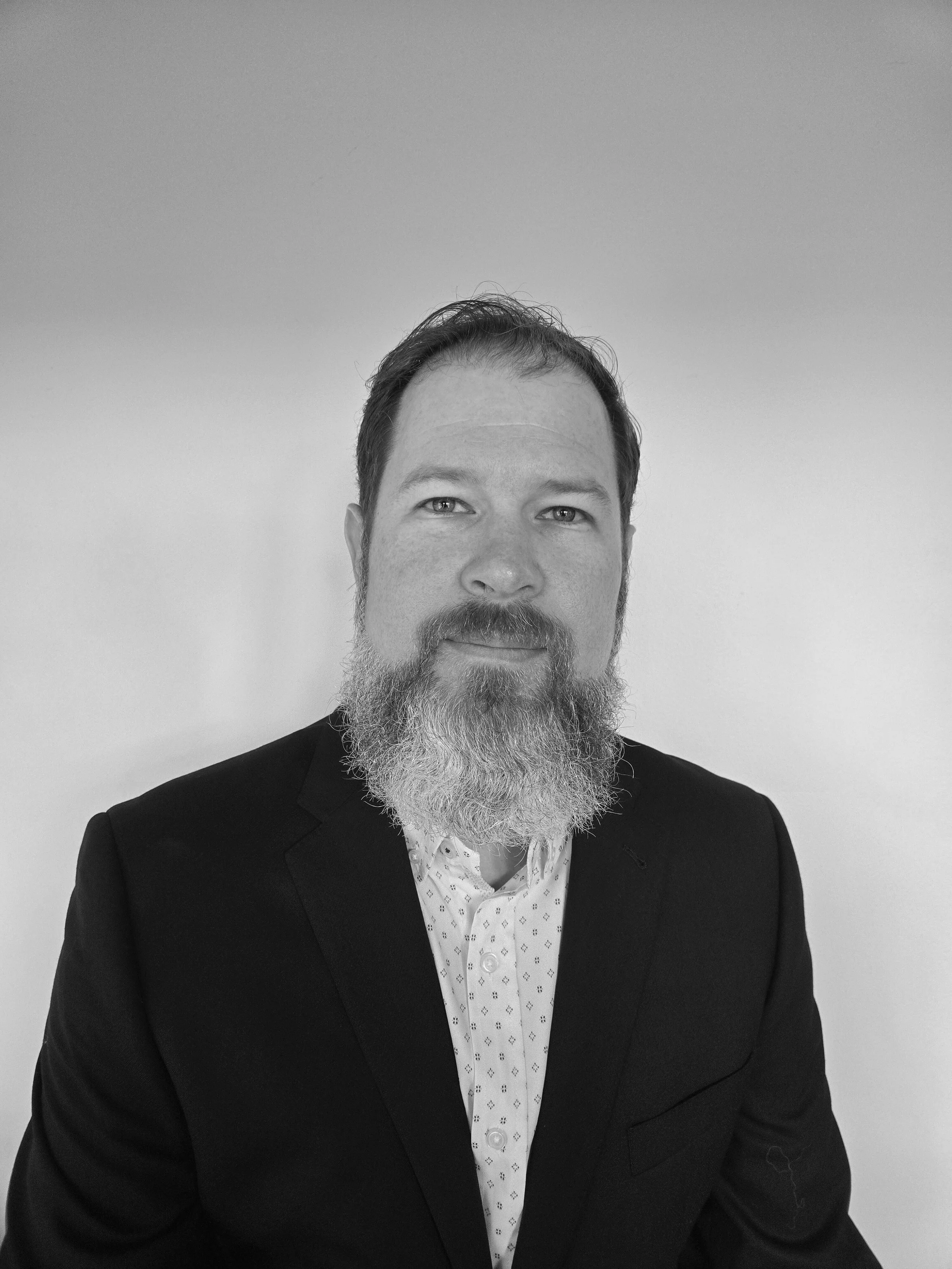 man with a beard wearing a jacket