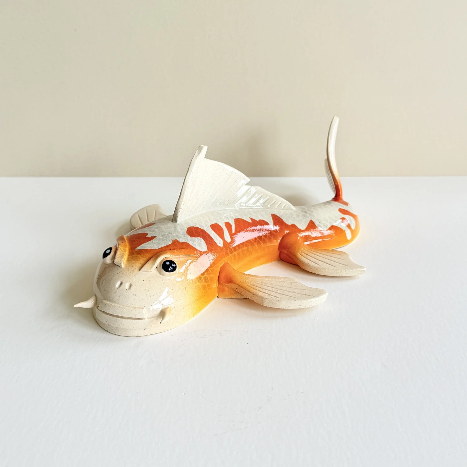 Black and orange spotted ceramic Koi wall art — sway concepts