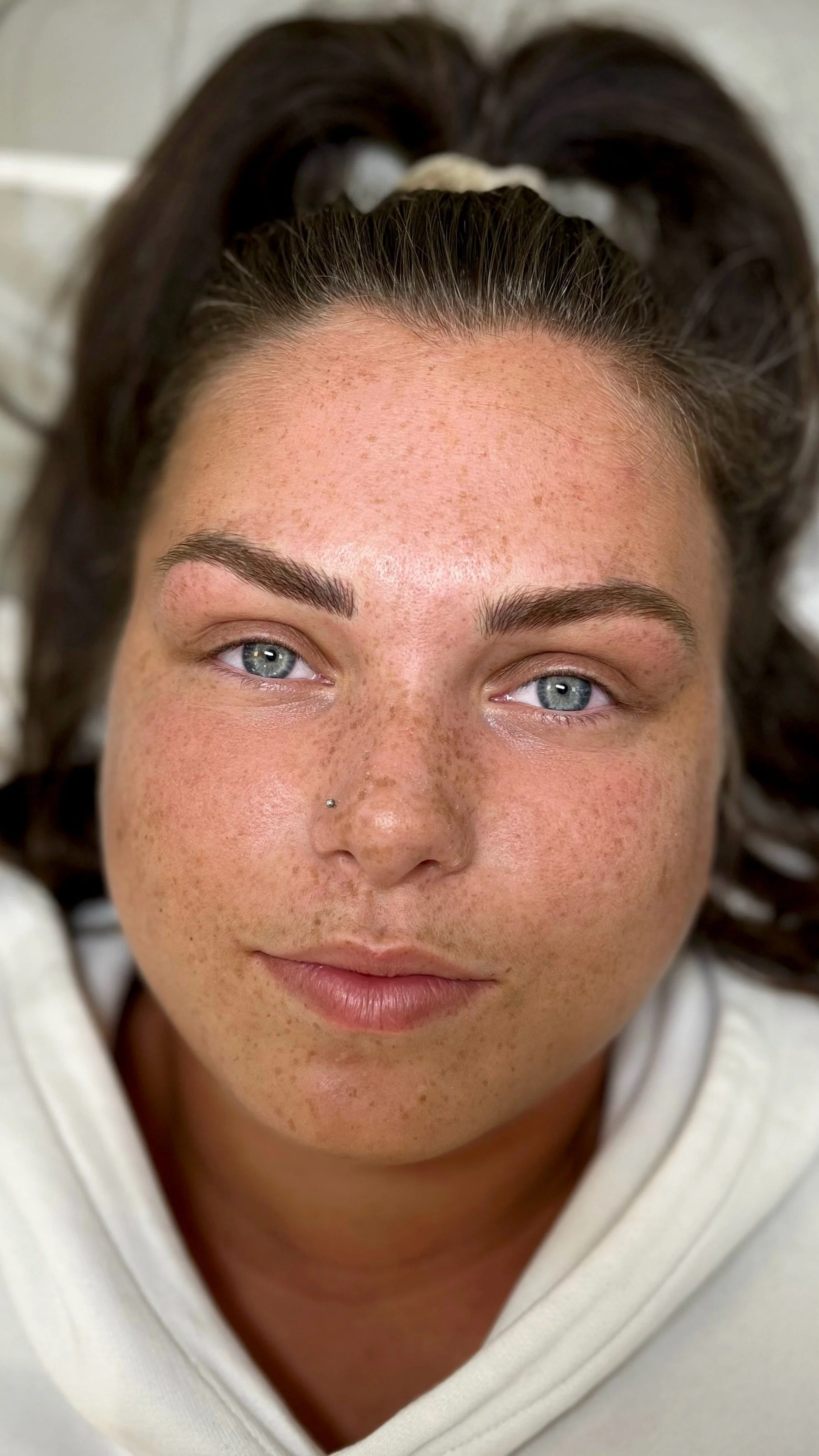 Freshly microbladed soft, natural strokes designed to restore symmetry and complement her unique facial features #microblading #bristol #defined #fluffy #eyebrows