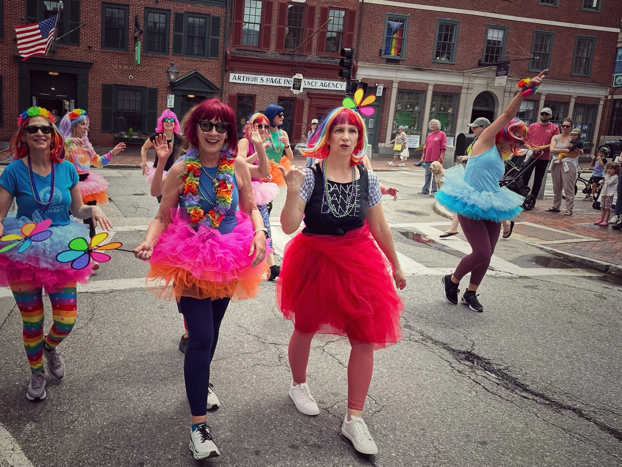 RANGE OF FEELING -- Newburyport, MA (May 31, 2025) -- At the end of a Pride Parade, most of the dancers are exhilarated. The leader is annoyed about some competing music drowning out their song, though.