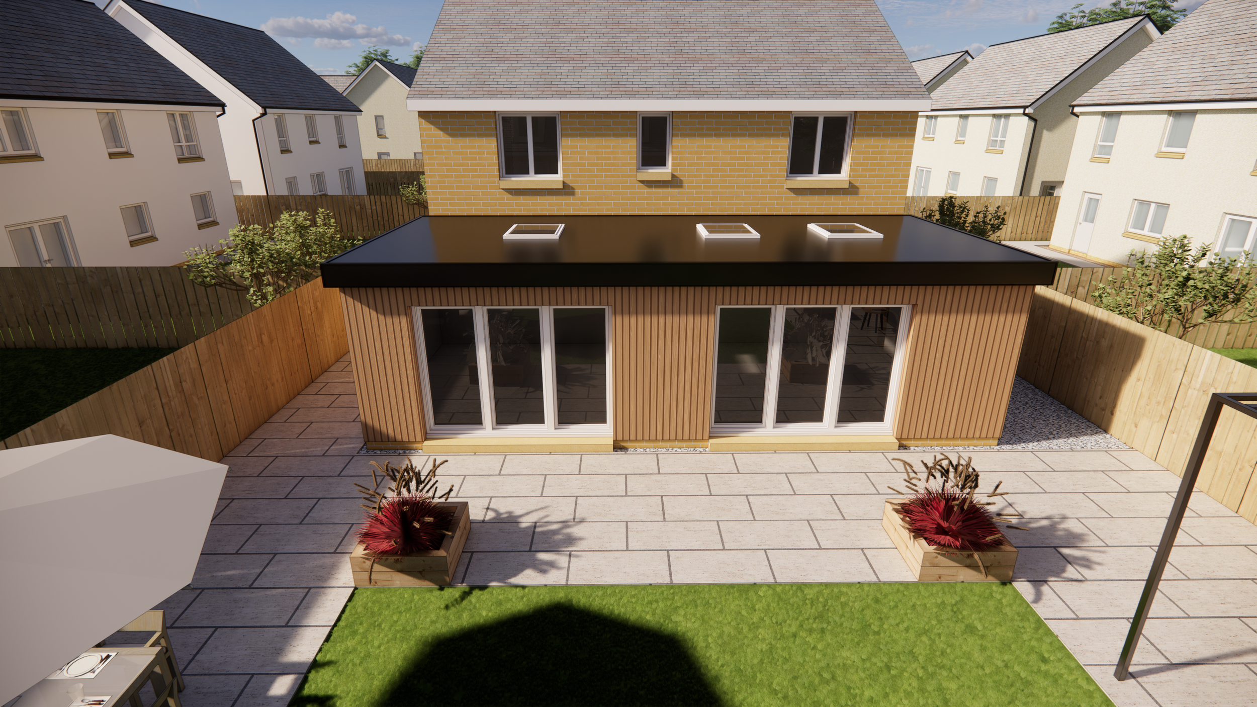 A modern backyard view with a wooden deck, two planters with decorative plants, a patio umbrella, and a fenced yard. A small building with large glass doors and a flat roof is in the background, with neighboring houses visible.