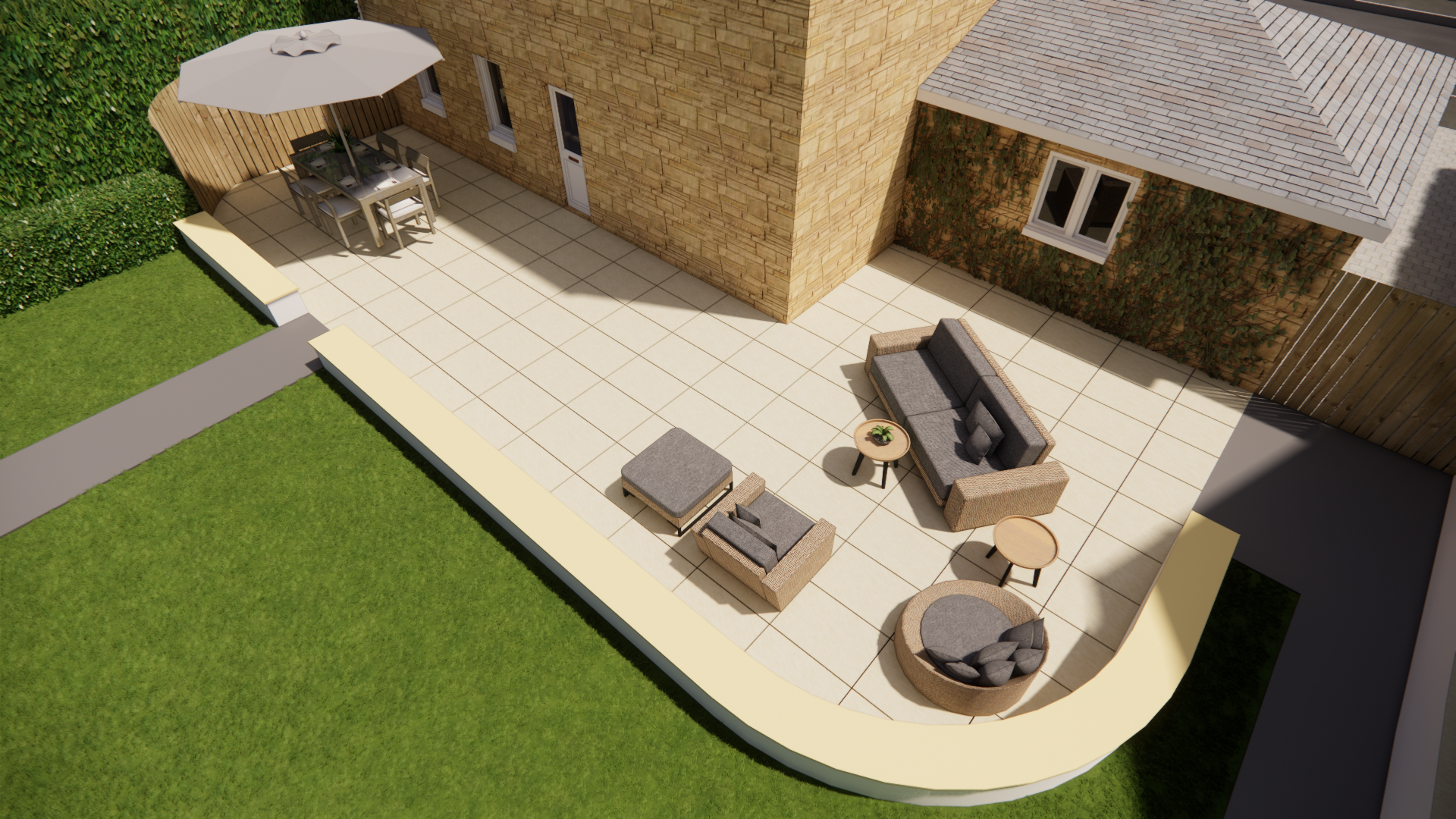 Top-down view of a backyard patio with outdoor furniture, including a dining table with umbrella, a sofa set, and decorative chairs, next to a house with stone and brick walls, surrounded by green grass and a lawn.