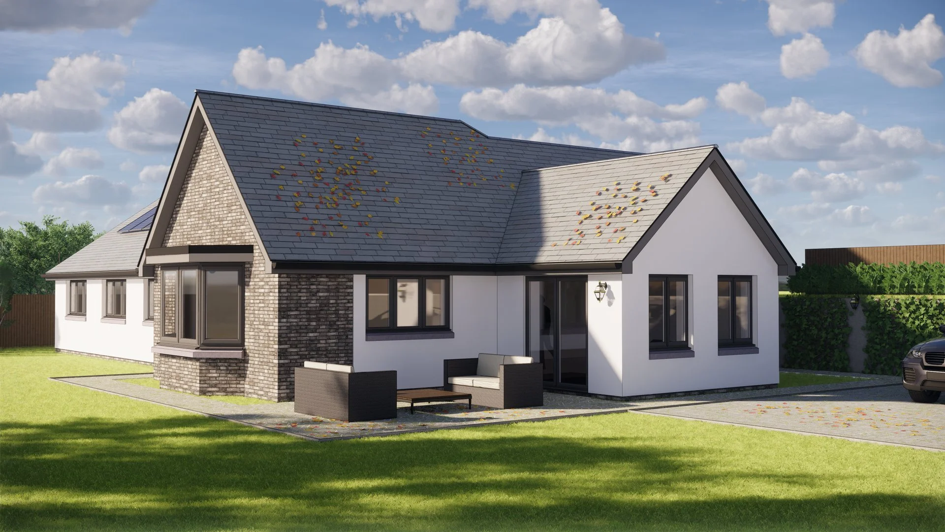 A modern suburban house with a gray roof, white walls, and black window frames, surrounded by a well-maintained lawn and outdoor seating area.