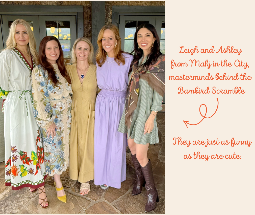 Five women standing together inside a building, smiling at the camera, with colorful dress and boots, with a beige background and orange text on the right side.