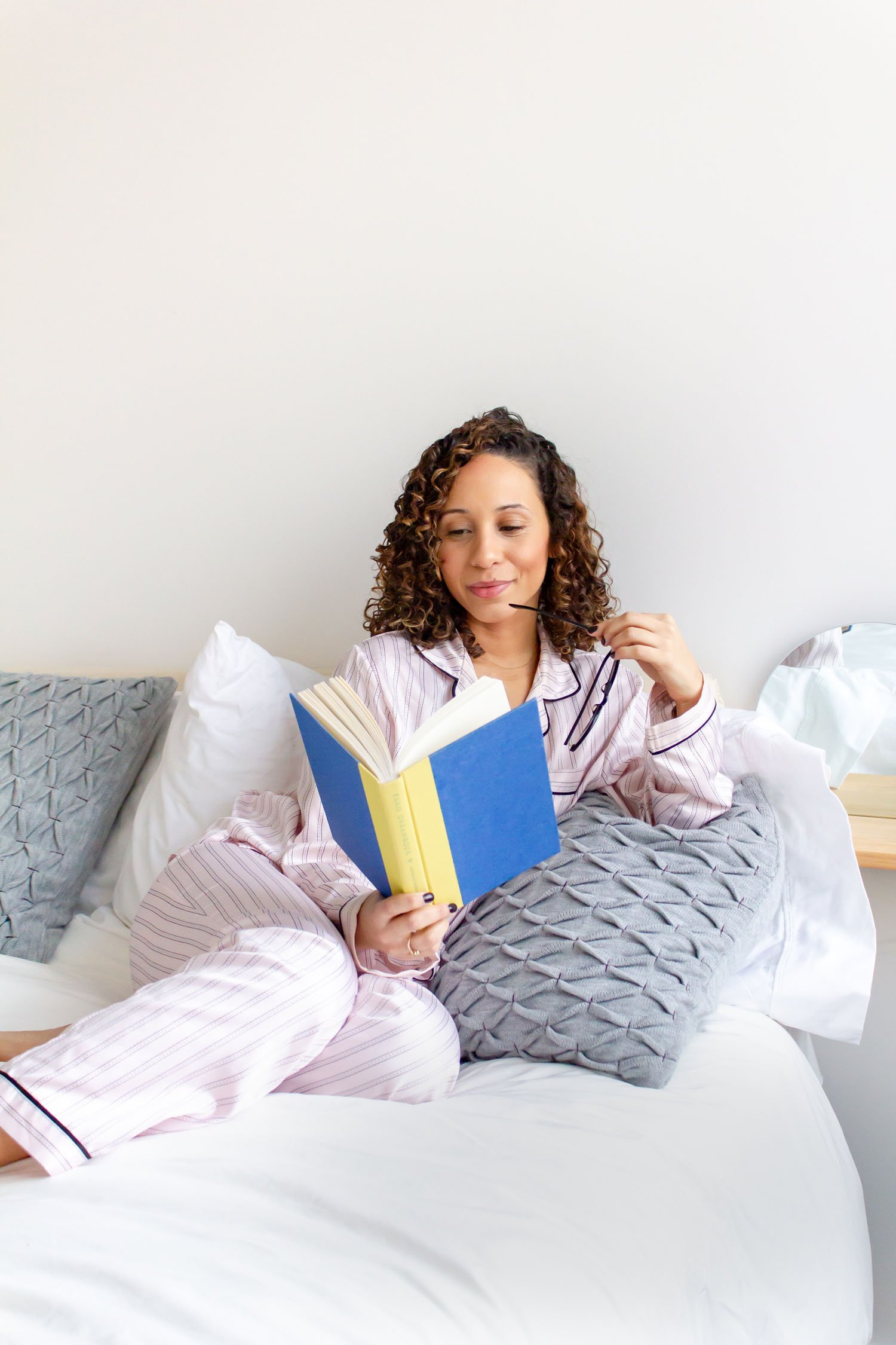 lifestyle-photo-reading-in-bed-personal-branding-nyc-tenth-and-kingston-photography.jpg