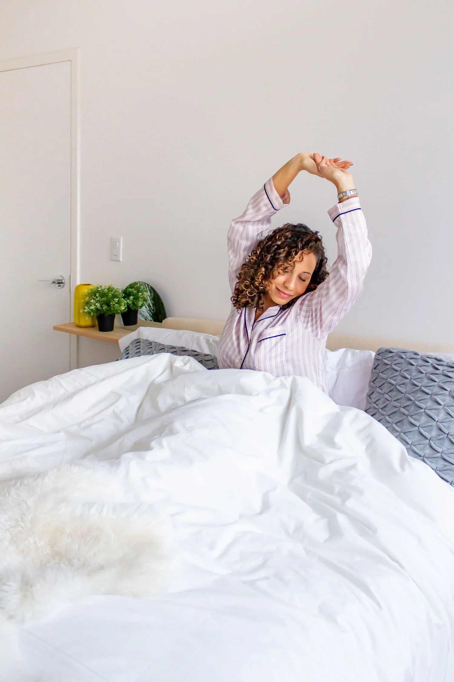 personal-branding-photo-stretching-in-bed-nyc-tenth-and-kingston-photography.jpg