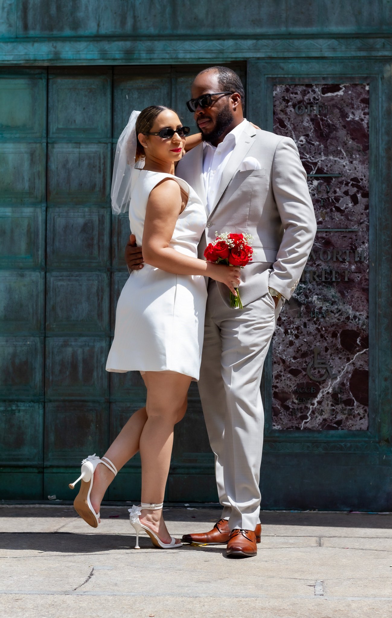 chic-nyc-elopement-couple-posing-stone-wall-tenth-and-kingston.jpg