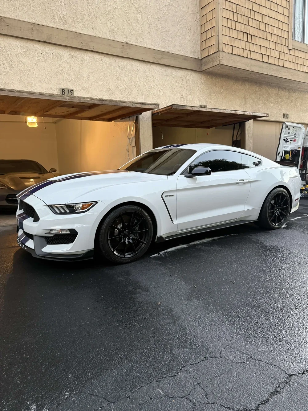 White Ford Mustang with racing stripes
