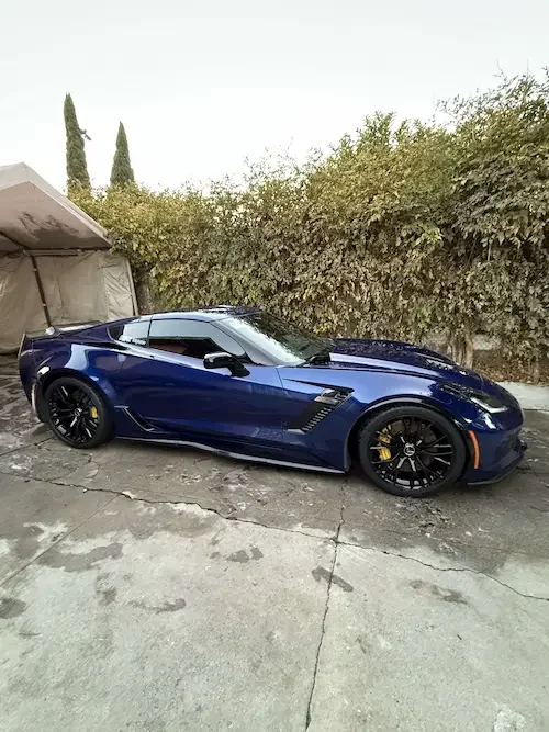 Perfectly polished Corvette with a mirror-like finish after professional paint correction.