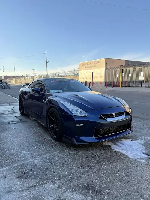 Blue Nissan GT-R receiving mobile ceramic coating in Los Angeles.